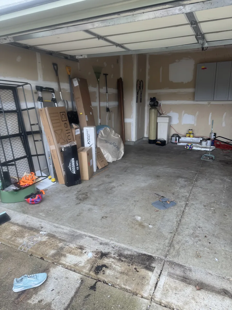 Garage full of tools and boxes before a ClearPath cleanout